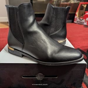 Black nine west ankle boots with gold accent